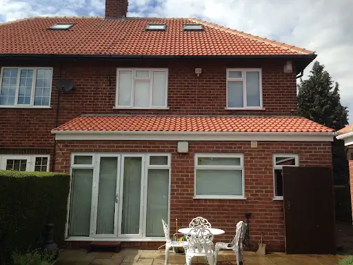 Stage 5 (After): Gorgeous completed tilled warm roof transformation with integrated sky lights