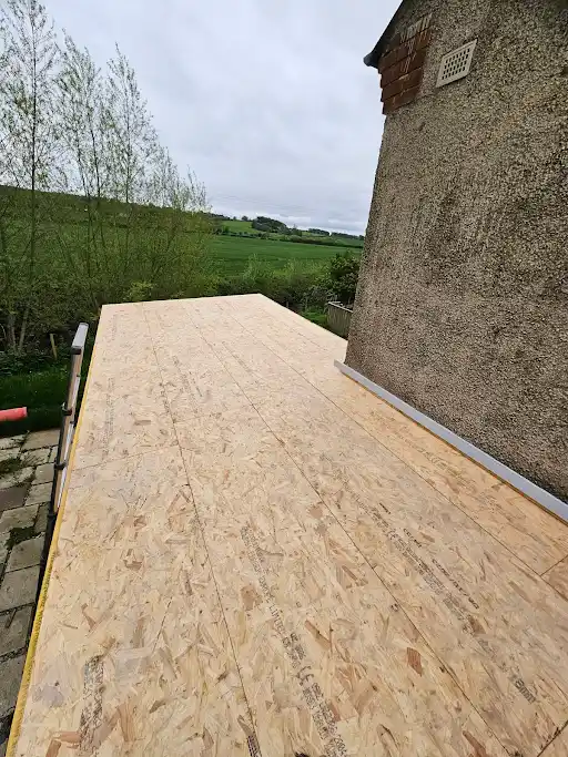 Second dormer re-decked against the chimney wall