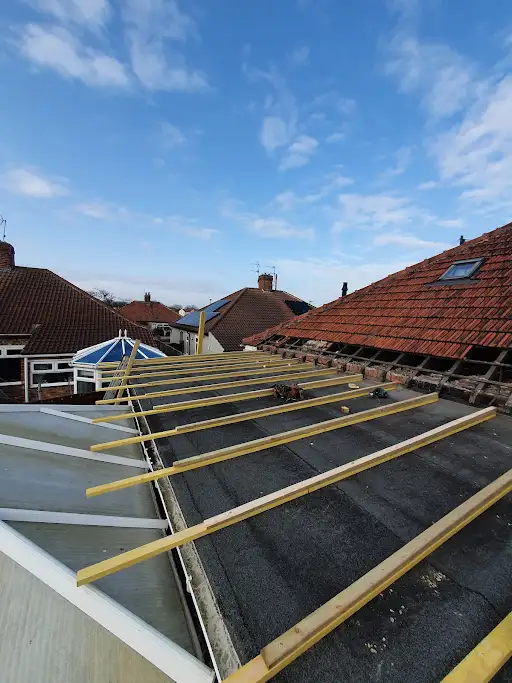 Stage 1 (Before): Faulty roof deck fully removed back down to the bare, main horizontal roof structural ceiling joists
