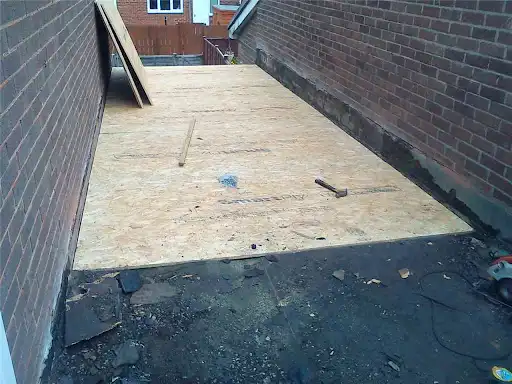 Flat roof stripped and re-decked ready for felt