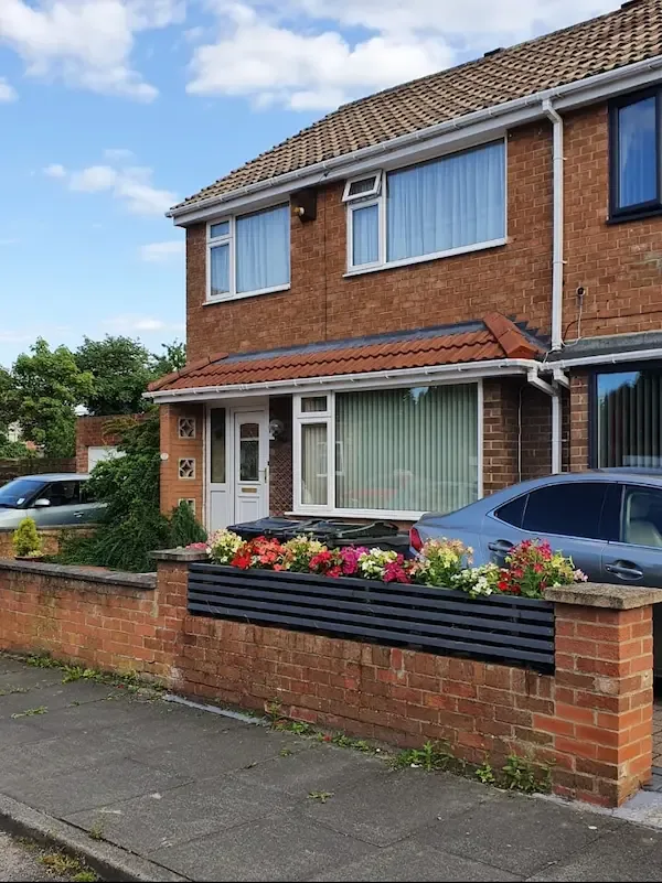 Red tiled canopy on an end-terrace house