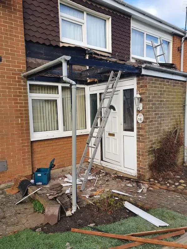 Old canopy roof stripped off over the front door