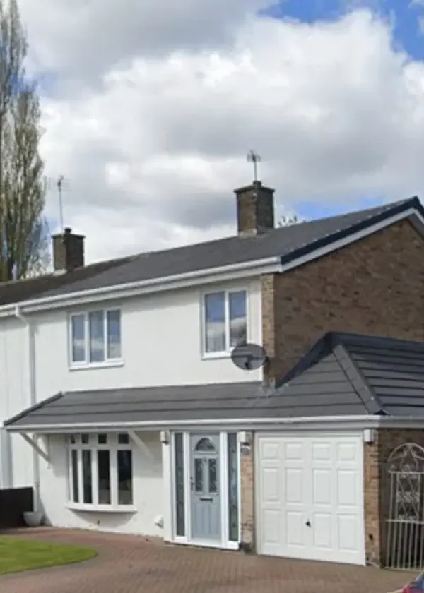 Tiled pitched roof built over a garage and front entrance